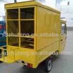 Yellow cargo rickshaw with electric power