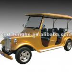 Yellow club car with electric powered golf cart-