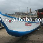 fiberglass canoe and speed boat-