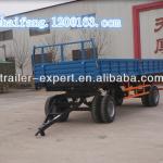 Tipping agricultural tractor trailer